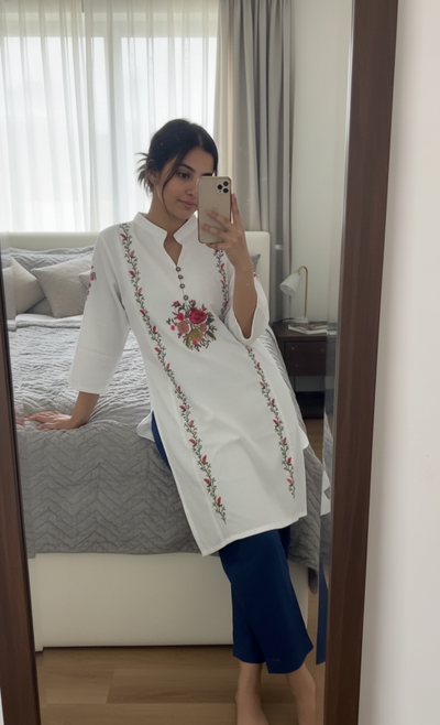 white shirt featuring exquisite floral embroidery 🌸✨D:2030