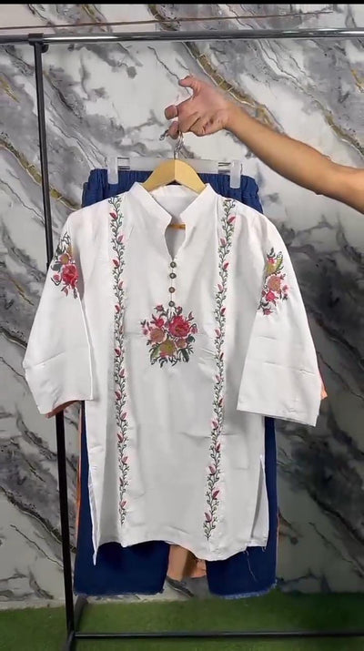 white shirt featuring exquisite floral embroidery 🌸✨D:2030